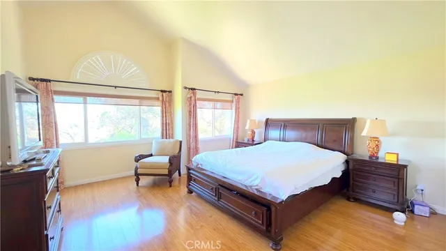 a bed room with a bed and a chair