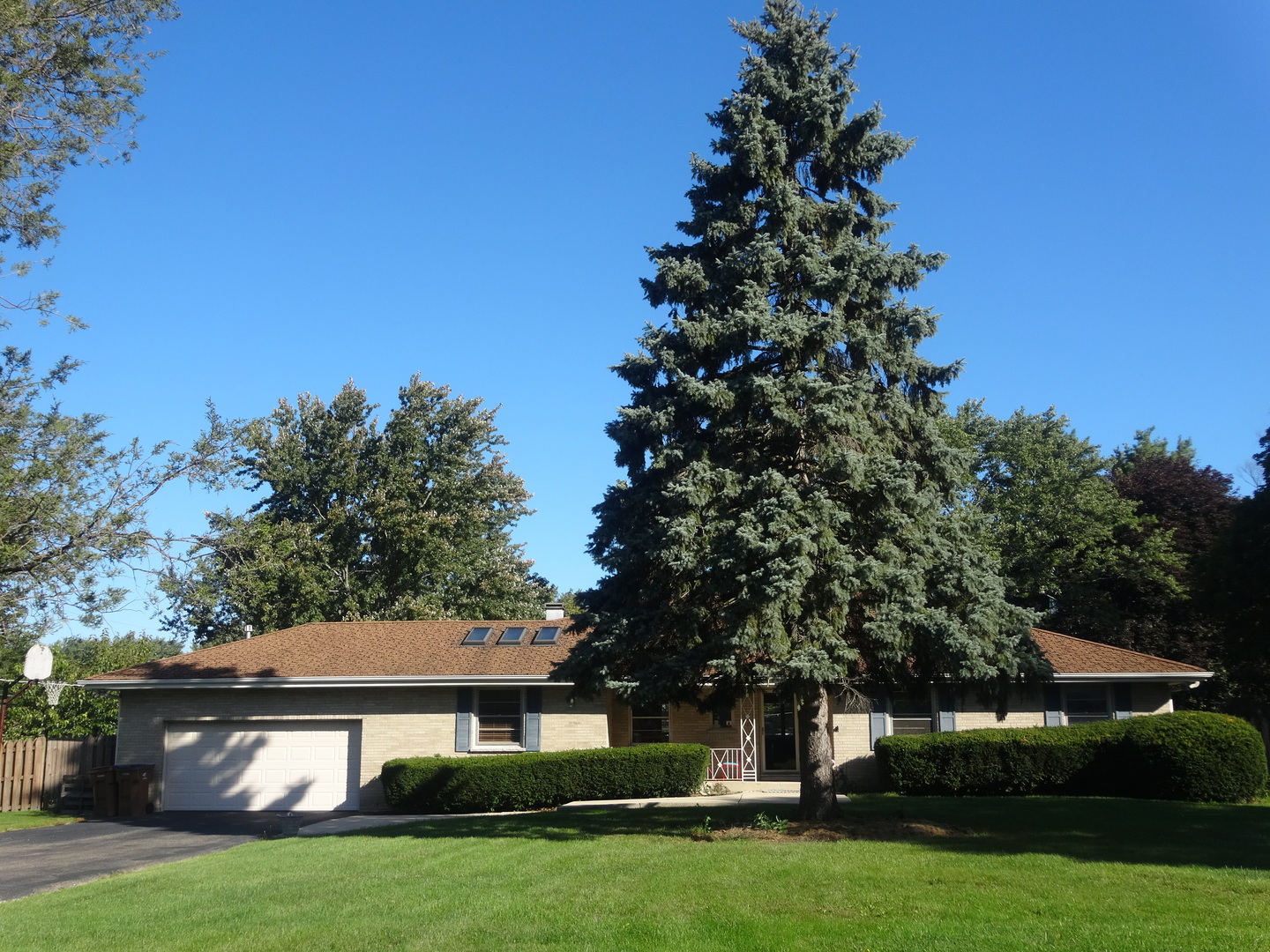 22W678 Poplar Road Glen Ellyn, IL 60137 - Photo 1 of 37 a front view of a house with a garden