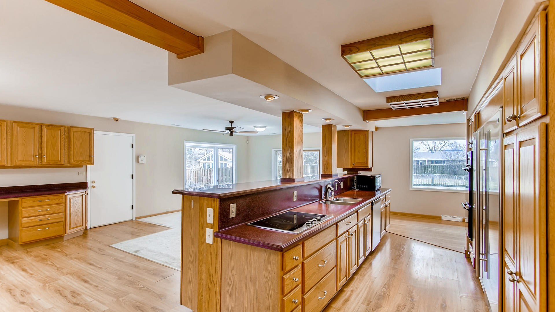 22W678 Poplar Road Glen Ellyn, IL 60137 - Photo 2 of 37 a kitchen that has a sink a stove and wooden floor