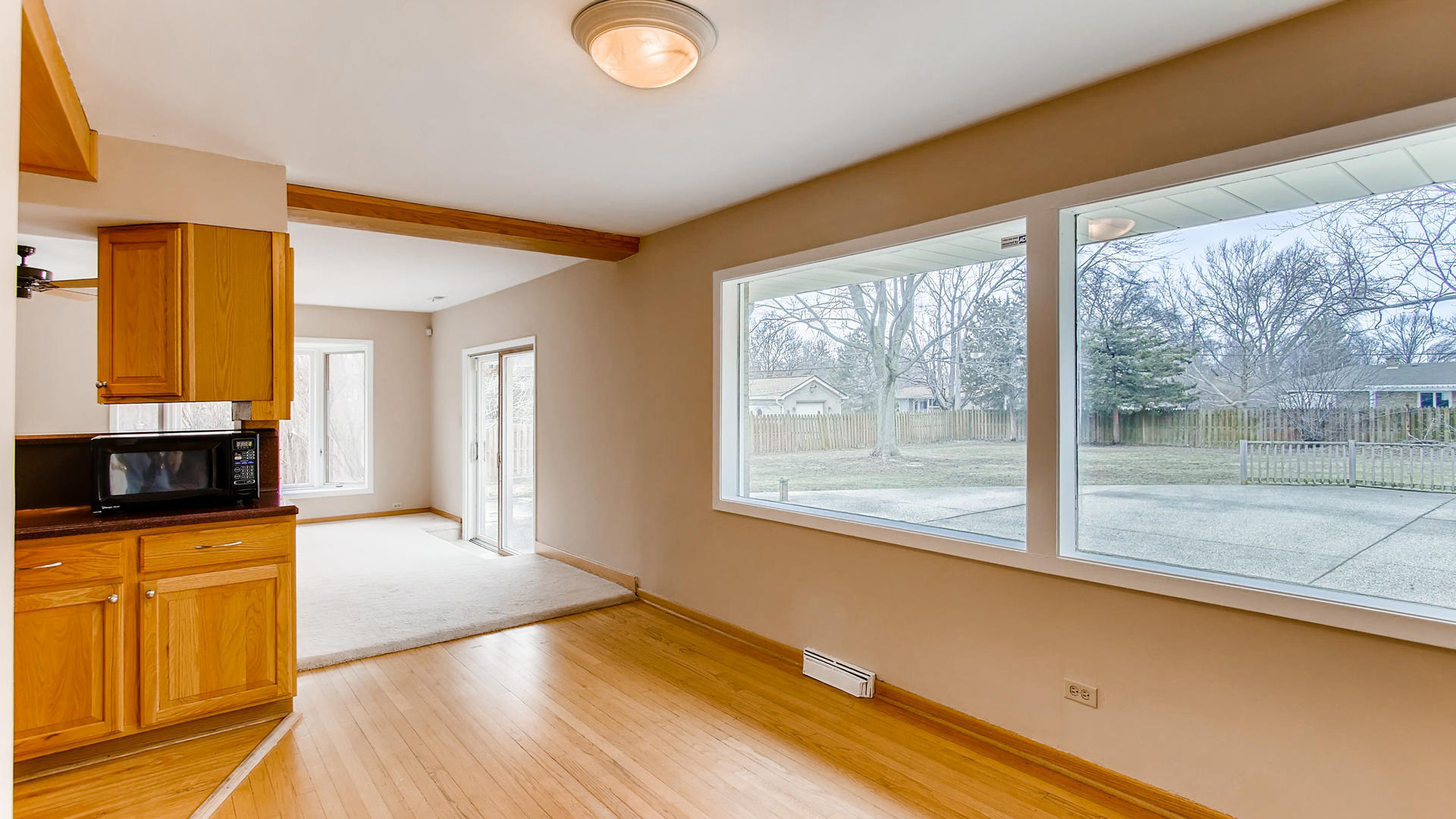 22W678 Poplar Road Glen Ellyn, IL 60137 - Photo 16 of 37 a view of a kitchen with wooden floor and a window