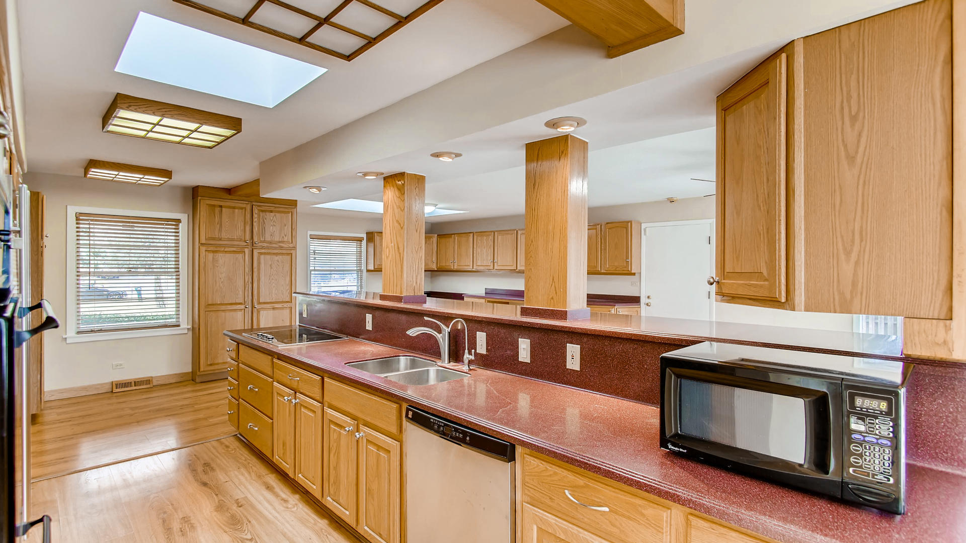 22W678 Poplar Road Glen Ellyn, IL 60137 - Photo 17 of 37 a kitchen with stainless steel appliances sink and cabinets