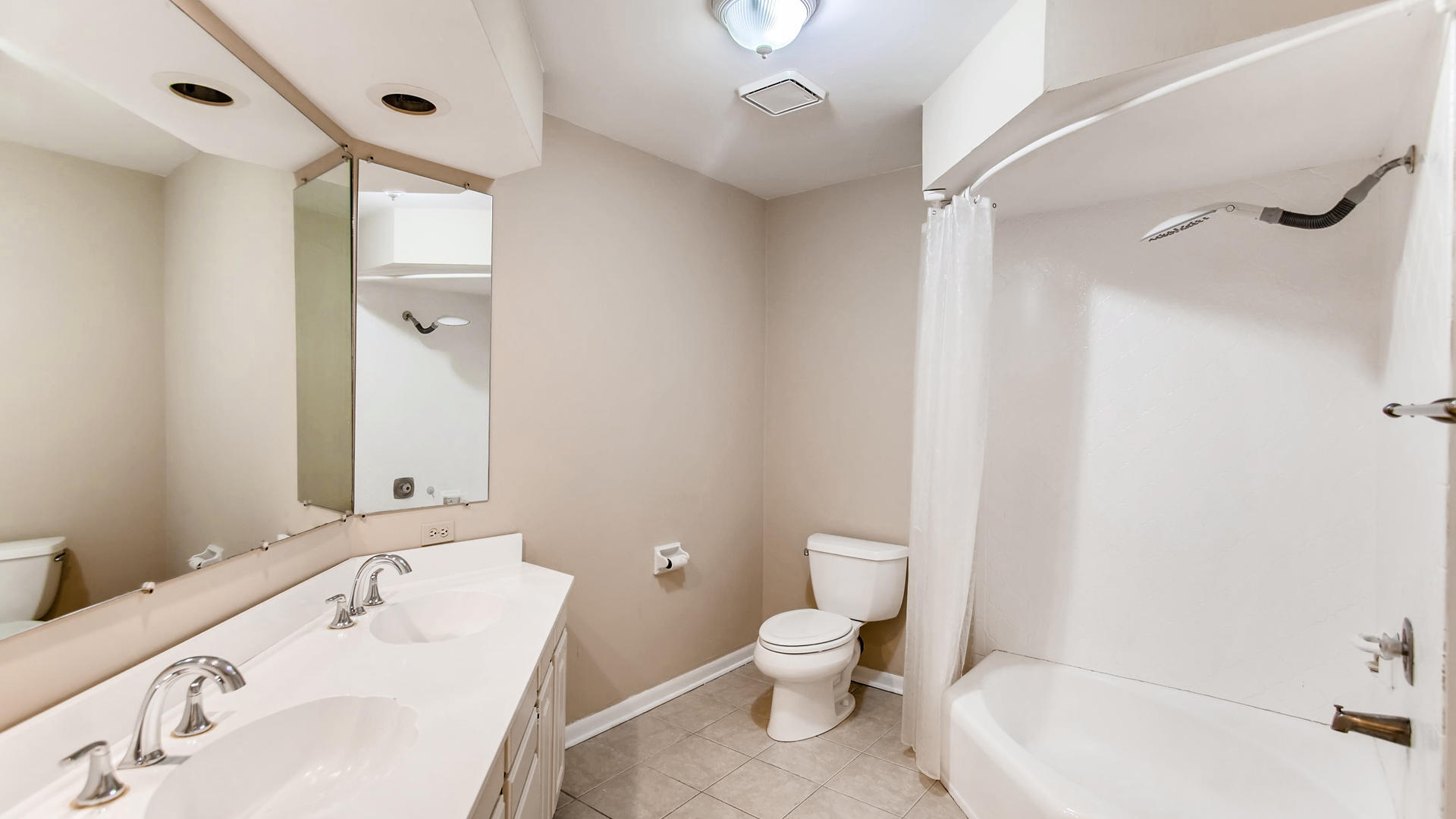 22W678 Poplar Road Glen Ellyn, IL 60137 - Photo 22 of 37 a bathroom with a sink a toilet and shower