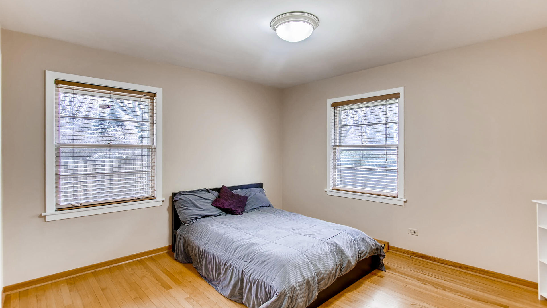 22W678 Poplar Road Glen Ellyn, IL 60137 - Photo 24 of 37 a bedroom with a bed and a window