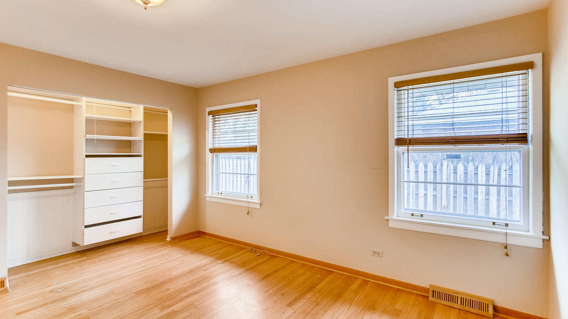 22W678 Poplar Road Glen Ellyn, IL 60137 - Photo 25 of 37 a view of an empty room with a window and wooden floor