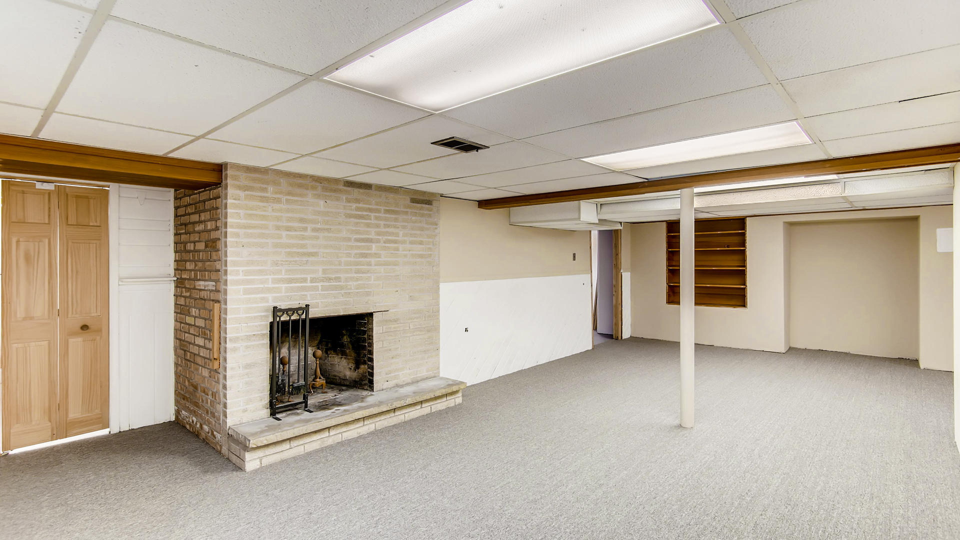 22W678 Poplar Road Glen Ellyn, IL 60137 - Photo 28 of 37 an empty room with furniture and fireplace