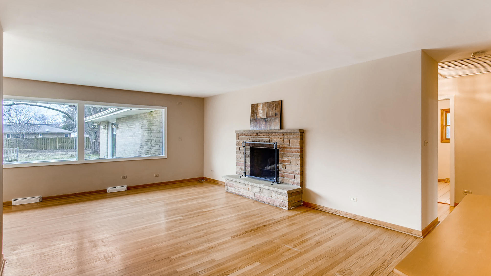 22W678 Poplar Road Glen Ellyn, IL 60137 - Photo 4 of 37 wooden floor fireplace and windows in an empty room
