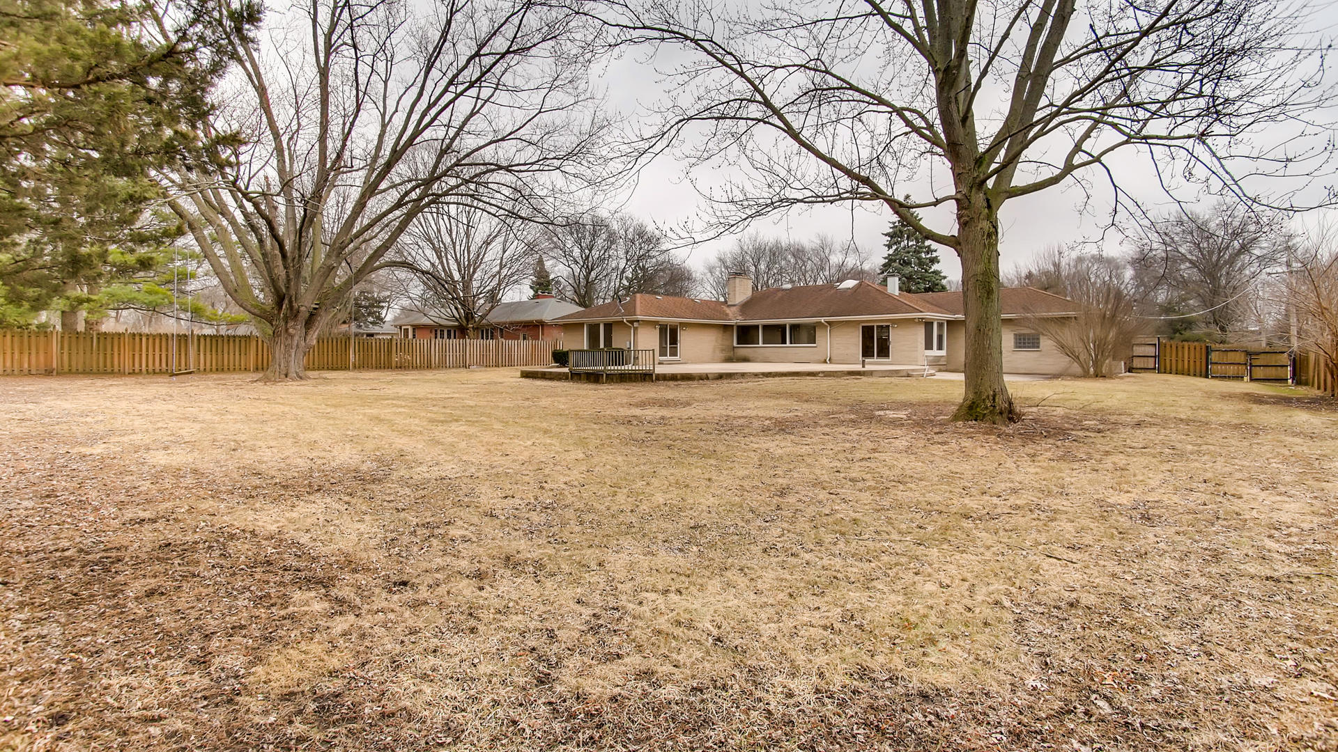 22W678 Poplar Road Glen Ellyn, IL 60137 - Photo 32 of 37 a view of a yard with a large tree