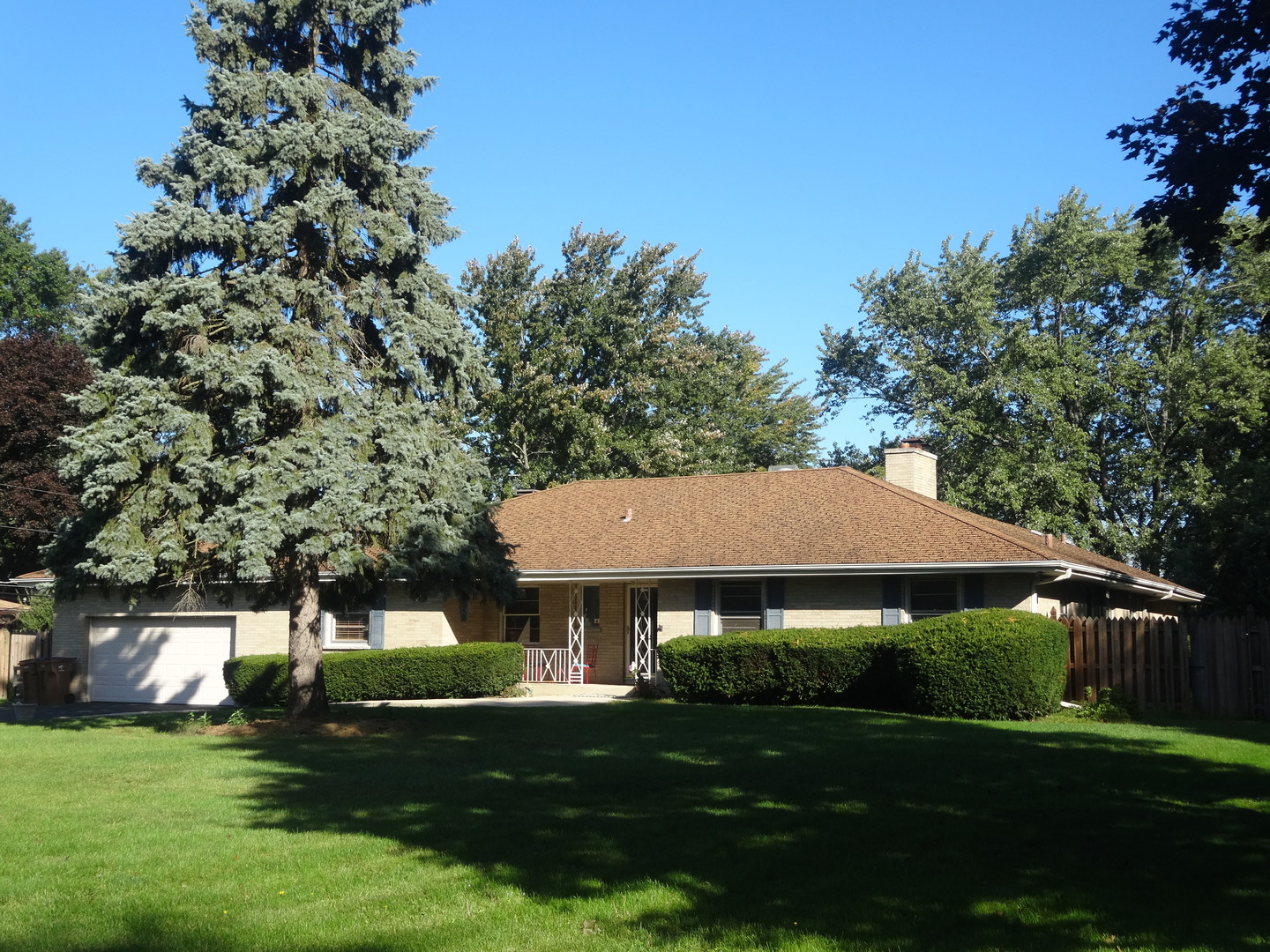 22W678 Poplar Road Glen Ellyn, IL 60137 - Photo 35 of 37 a view of a big house with a big yard and potted plants and large trees