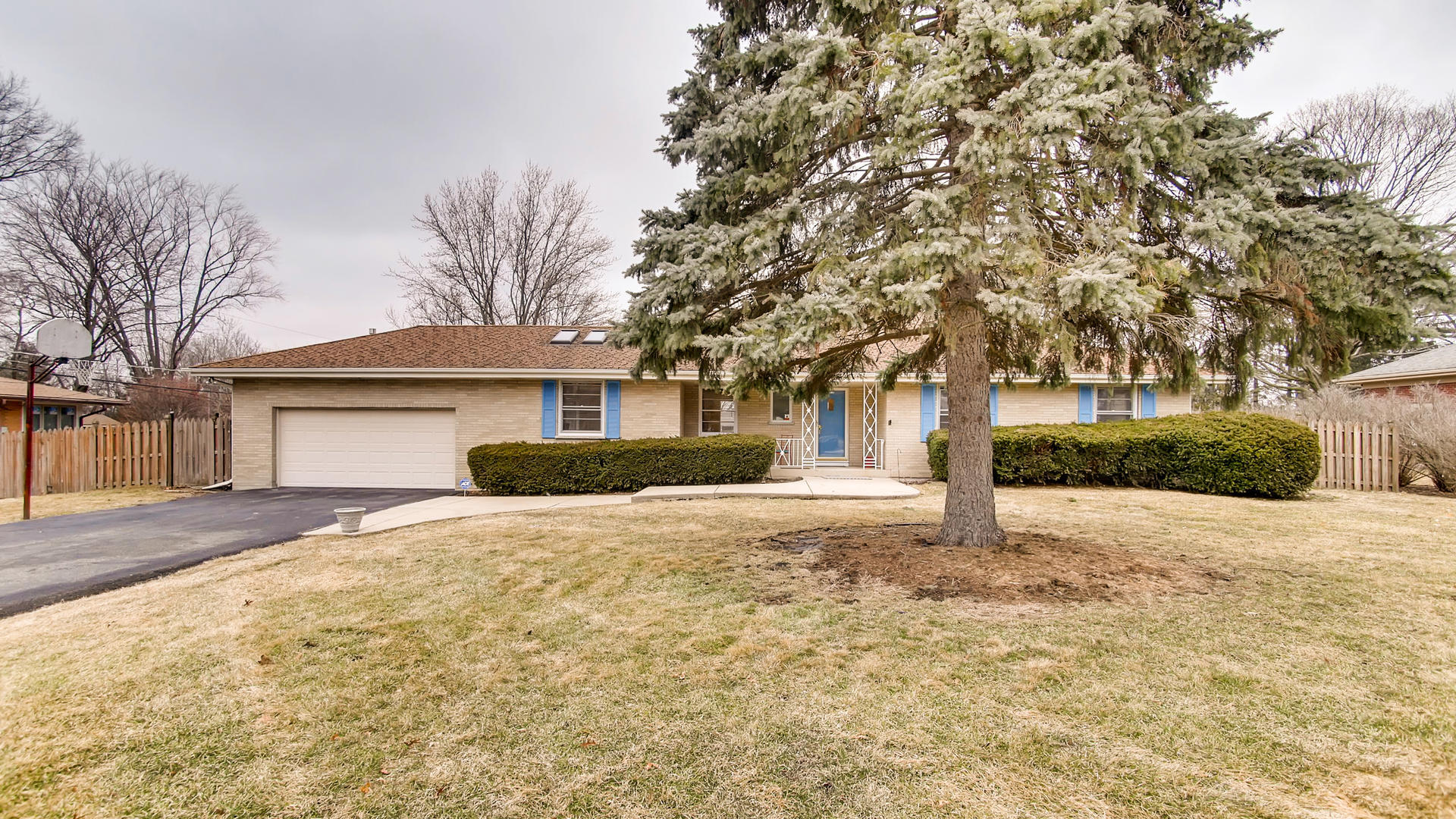 22W678 Poplar Road Glen Ellyn, IL 60137 - Photo 37 of 37 a front view of a house with a yard and garage