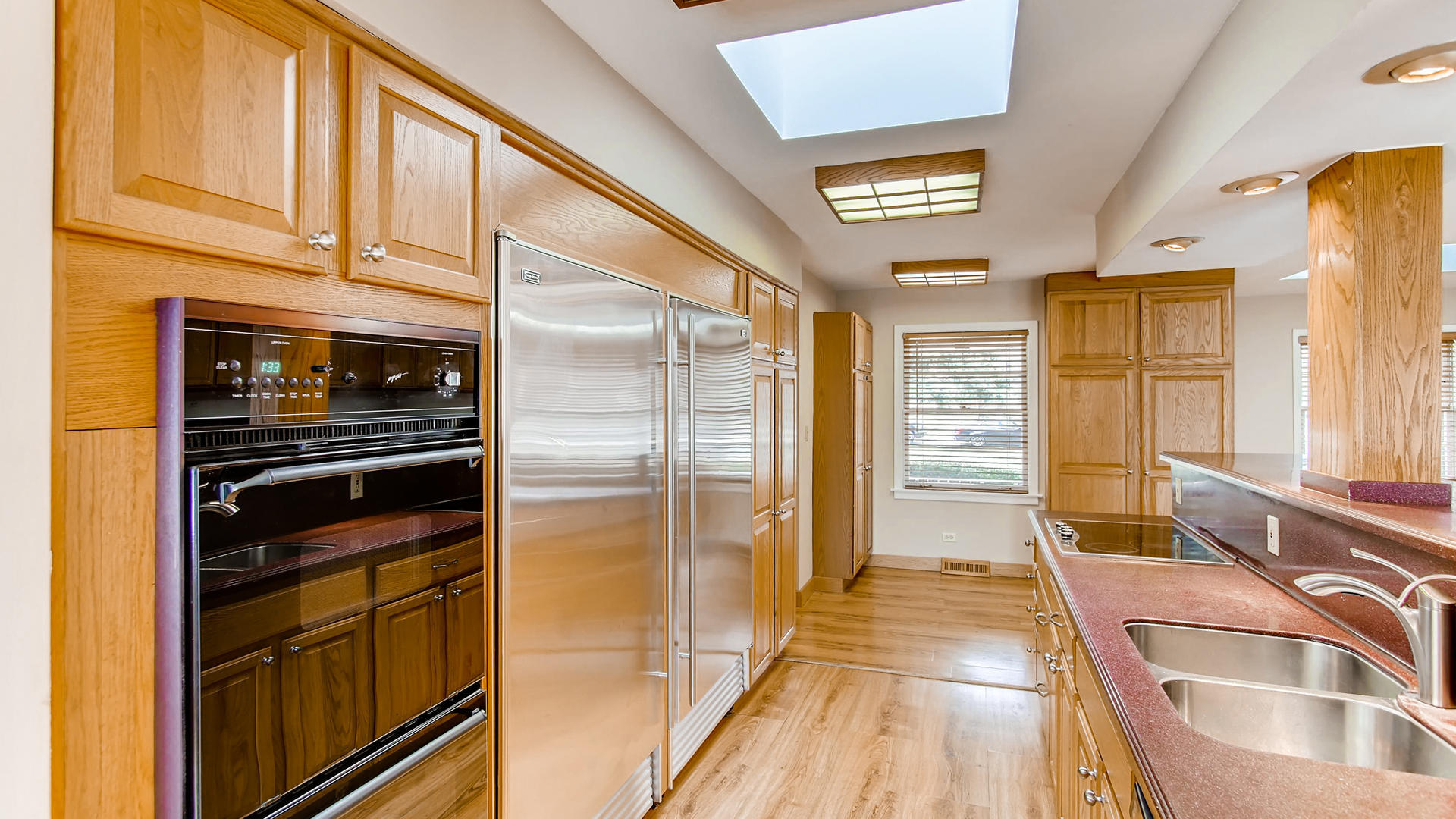 22W678 Poplar Road Glen Ellyn, IL 60137 - Photo 6 of 37 a kitchen with granite countertop stainless steel appliances and counter space