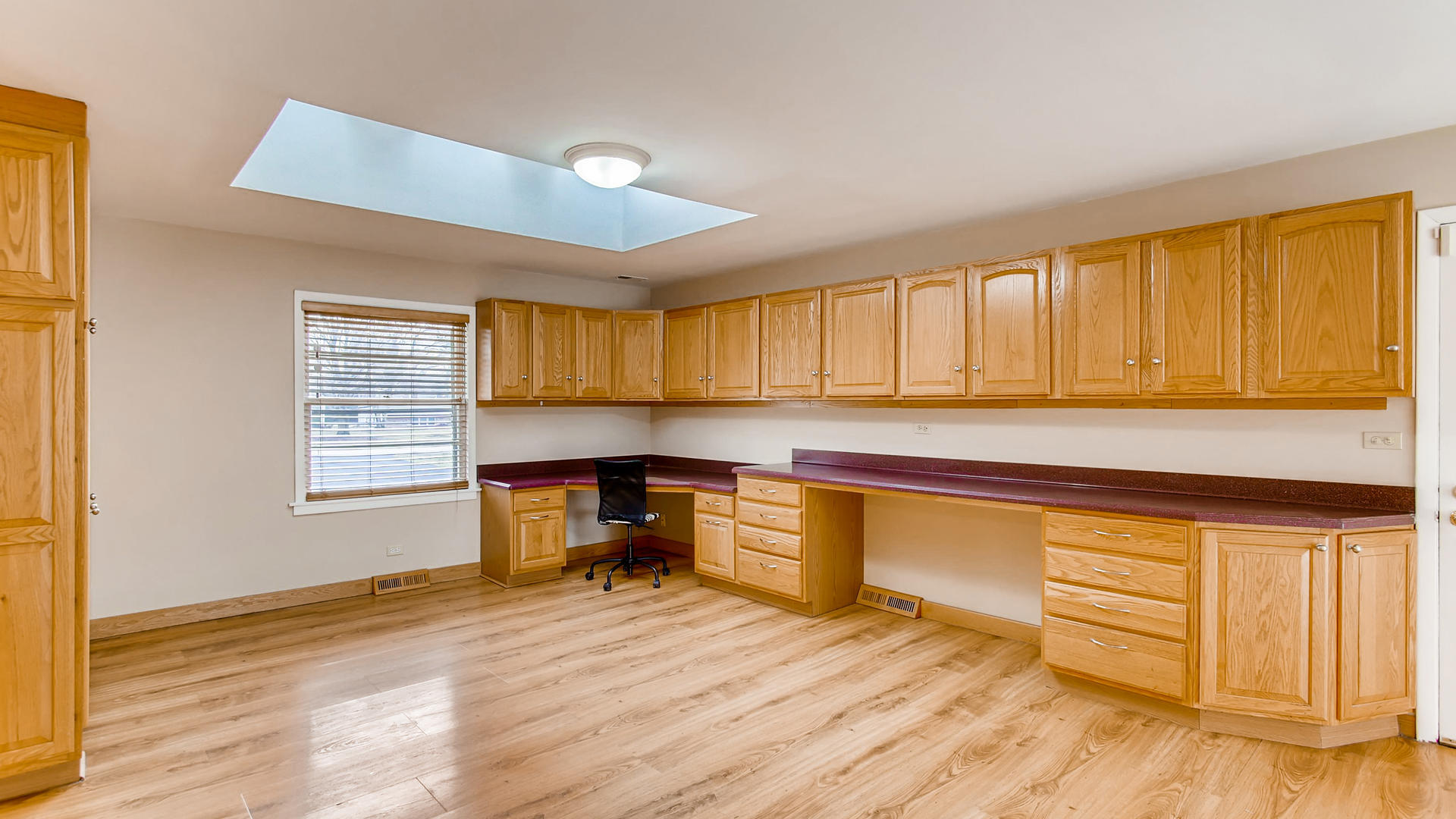 22W678 Poplar Road Glen Ellyn, IL 60137 - Photo 7 of 37 a kitchen with granite countertop wooden cabinets a sink and dishwasher