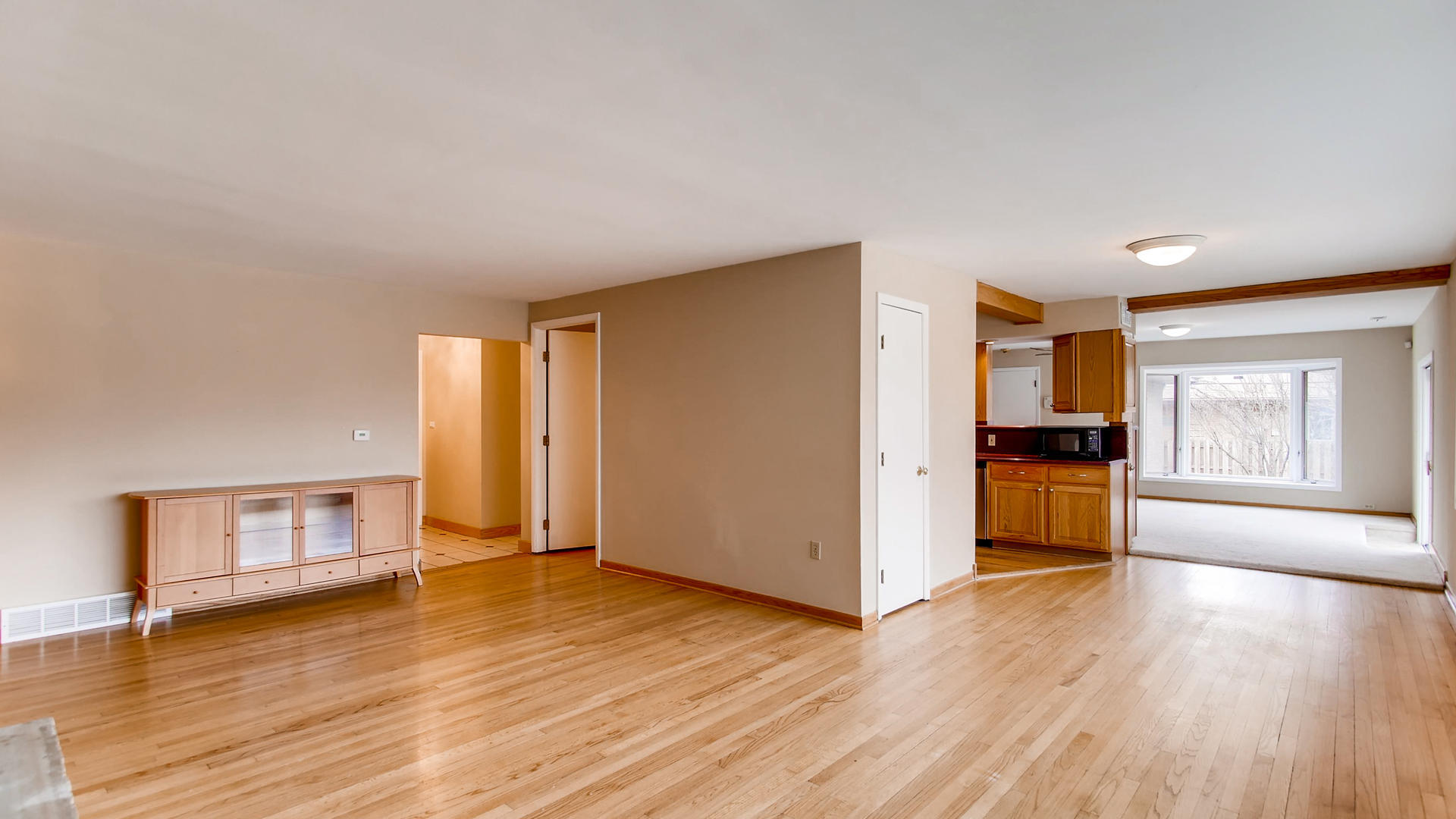 22W678 Poplar Road Glen Ellyn, IL 60137 - Photo 8 of 37 a view of empty room with kitchen and window