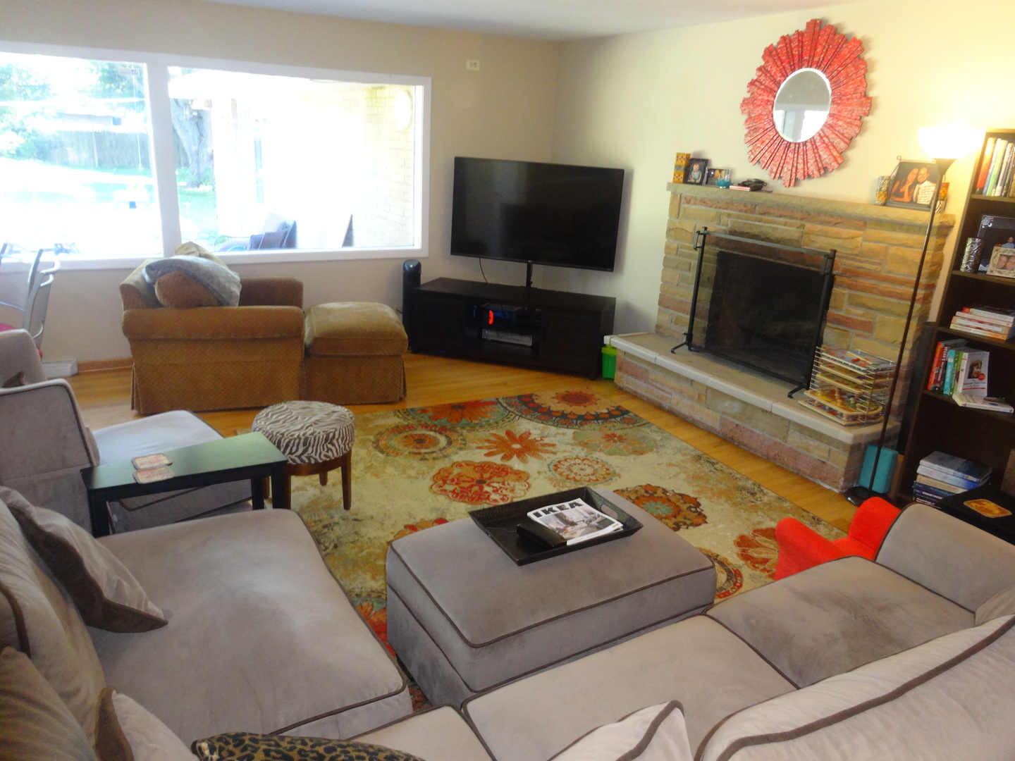 22W678 Poplar Road Glen Ellyn, IL 60137 - Photo 10 of 37 a living room with furniture a flat screen tv and a fireplace