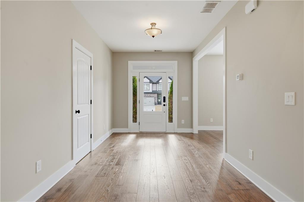 12 Bridgestone Way Cartersville, GA 30120 - Photo 13 of 46 wooden floor in an empty room with a window