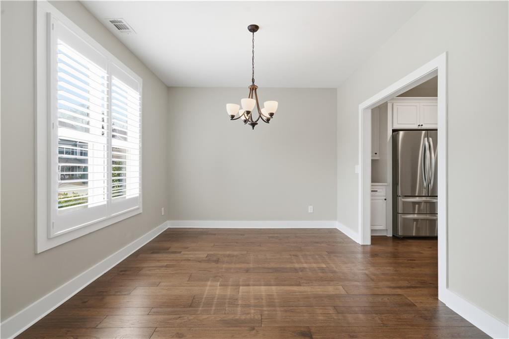12 Bridgestone Way Cartersville, GA 30120 - Photo 15 of 46 a view of a room with wooden floor chandelier and windows