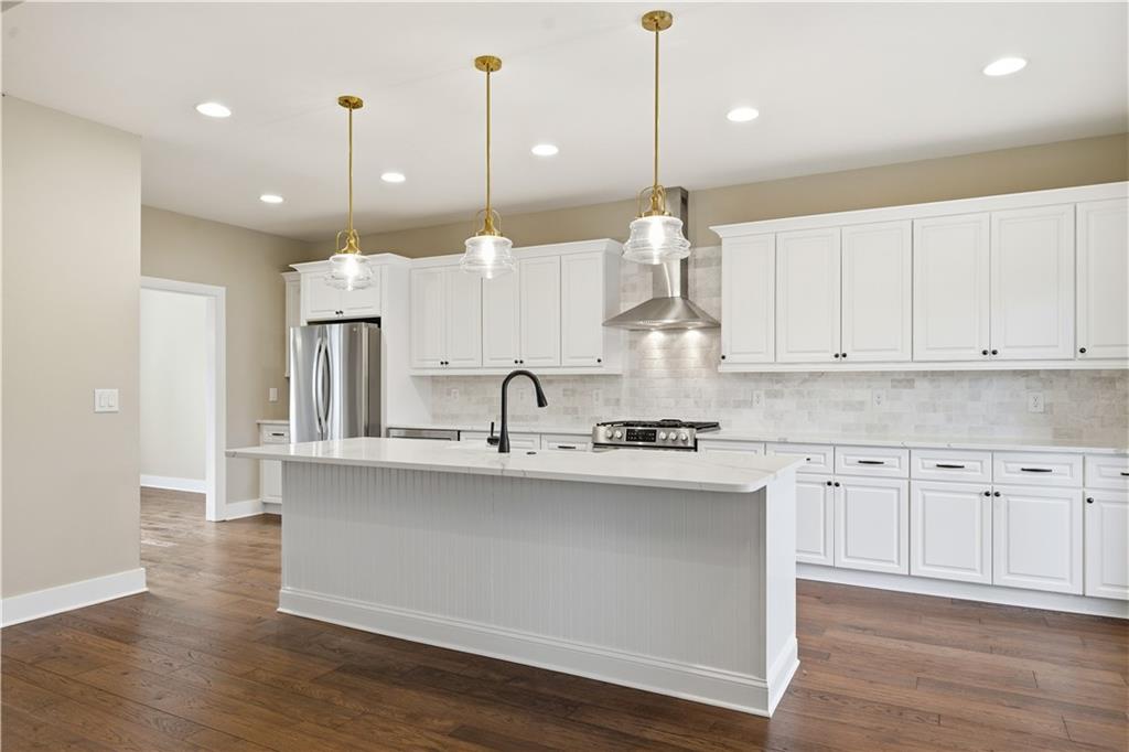12 Bridgestone Way Cartersville, GA 30120 - Photo 2 of 46 a large kitchen with cabinets and wooden floor