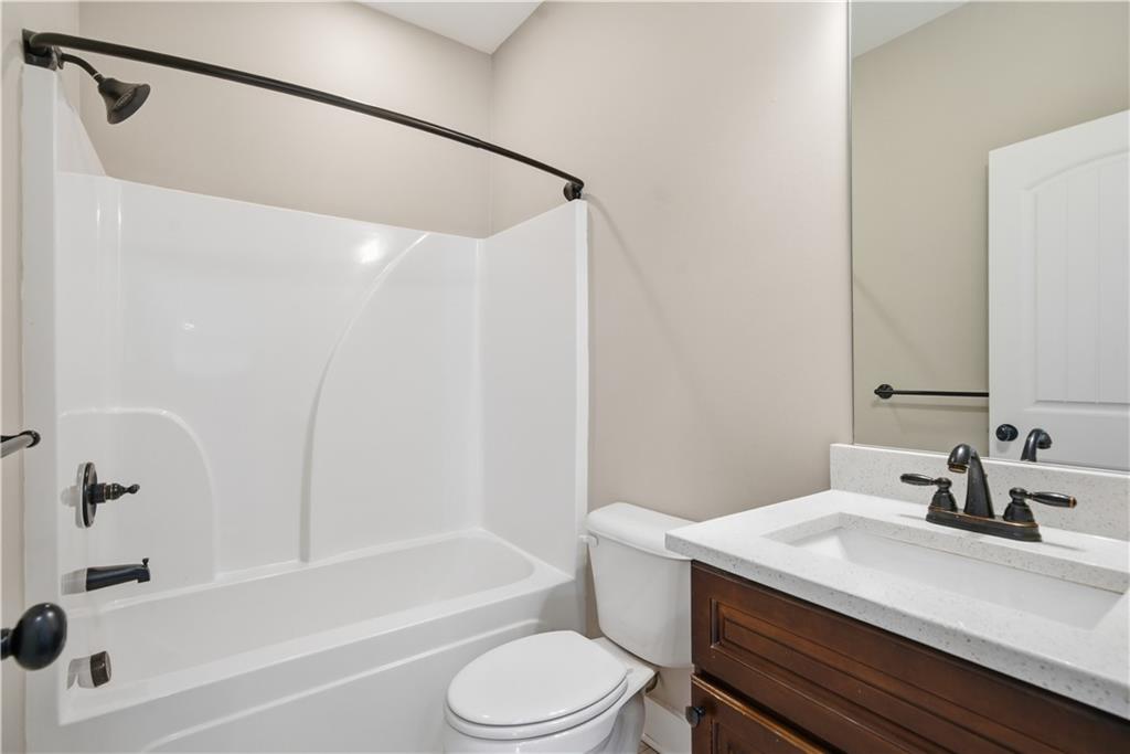 12 Bridgestone Way Cartersville, GA 30120 - Photo 23 of 46 a bathroom with a sink a toilet and a bathtub