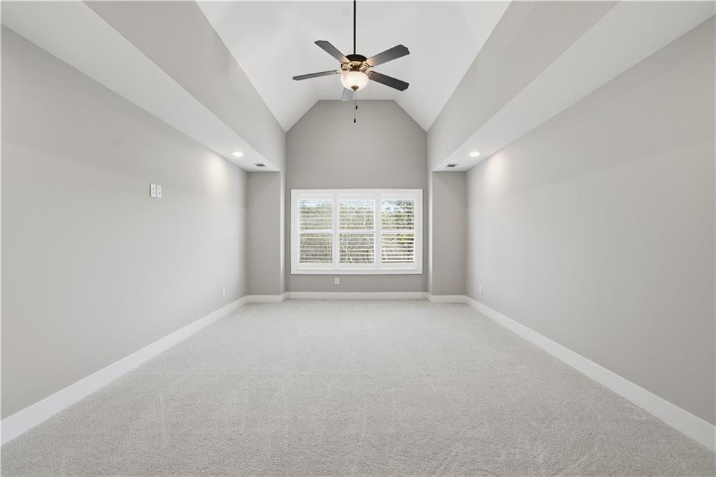 12 Bridgestone Way Cartersville, GA 30120 - Photo 26 of 46 an empty room with a ceiling fan and window