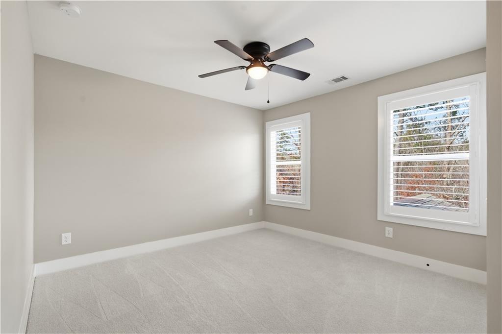 12 Bridgestone Way Cartersville, GA 30120 - Photo 32 of 46 a view of an empty room with a window