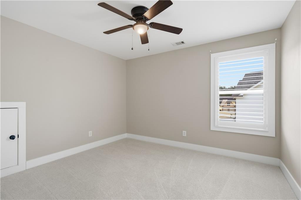 12 Bridgestone Way Cartersville, GA 30120 - Photo 34 of 46 an empty room with a window and a fan