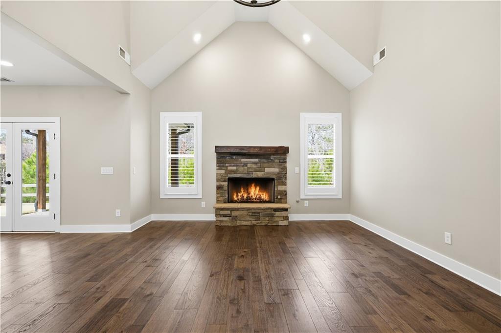 12 Bridgestone Way Cartersville, GA 30120 - Photo 5 of 46 a view of an empty room with wooden floor fireplace and a window