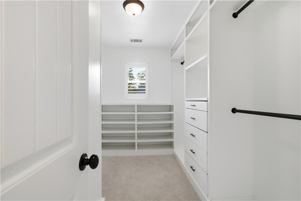 12 Bridgestone Way Cartersville, GA 30120 - Photo 9 of 46 a view of walk in closet with empty racks