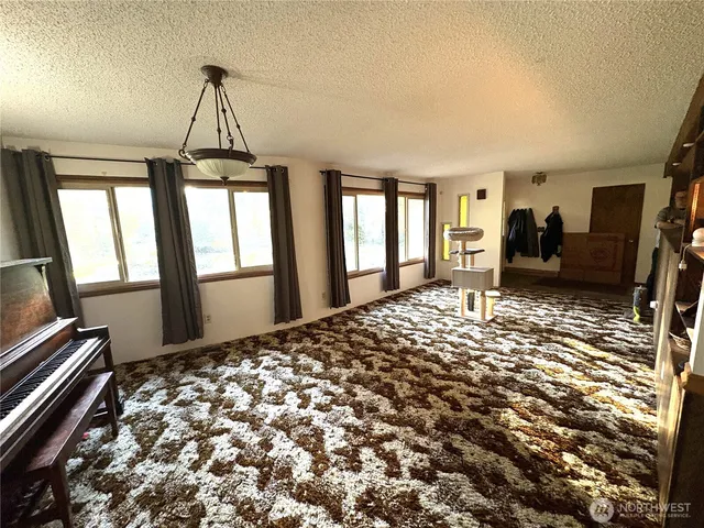 a bedroom with furniture and window