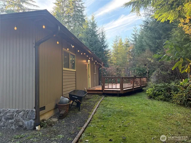 a view of a house with a backyard and a patio