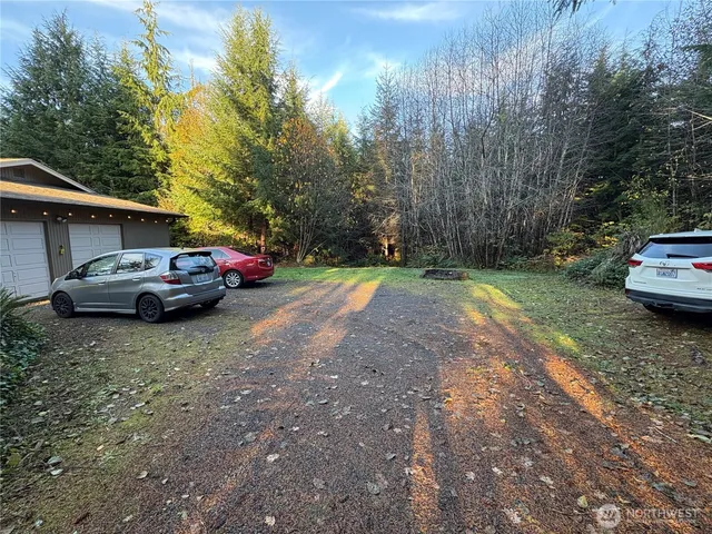 a view of street with parked cars