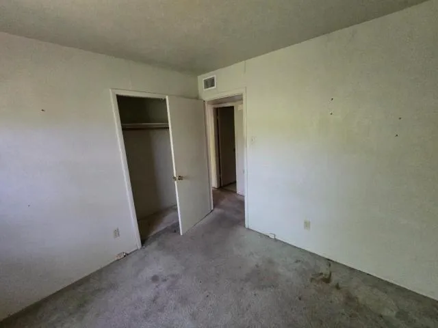 an empty room with closet