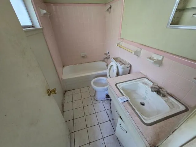 a bathroom with a sink toilet and bathtub