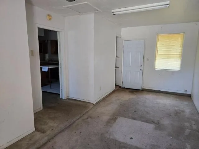 a view of an empty room with a window