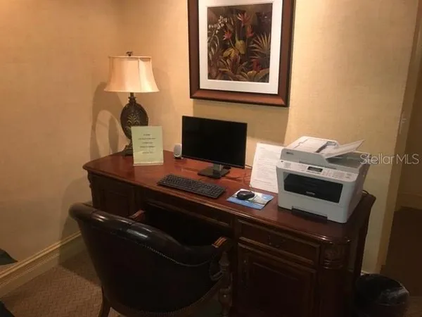 a view of a workspace with furniture