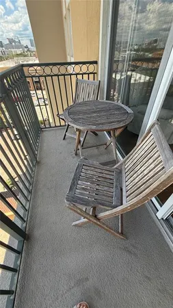a view of balcony with wooden floor