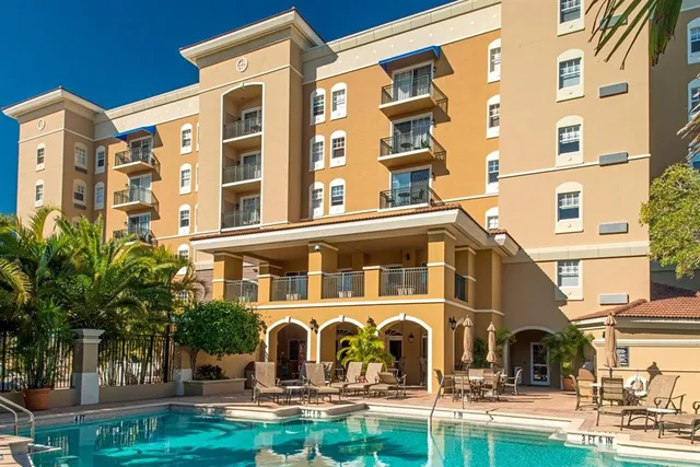 a view of a chairs and table in patio