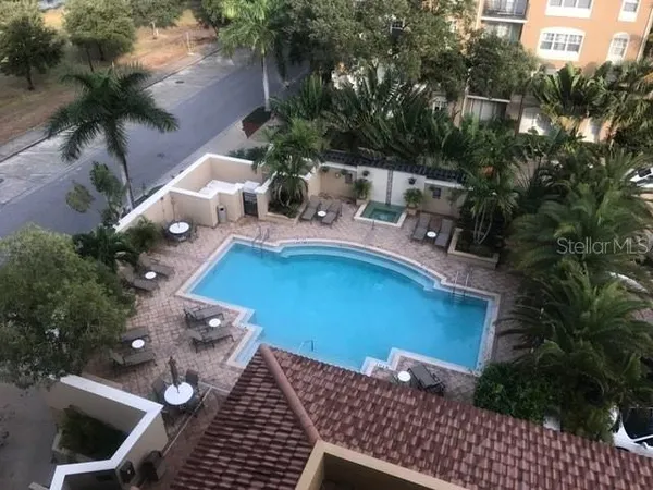 a view of balcony with wooden floor and outdoor seating