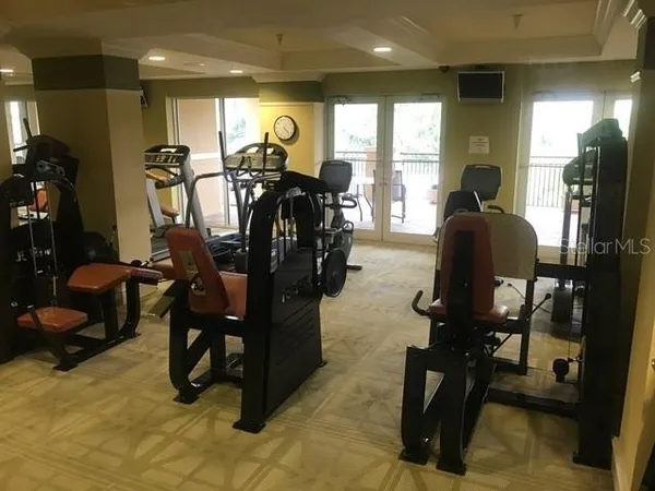 a front view of a house with a tree