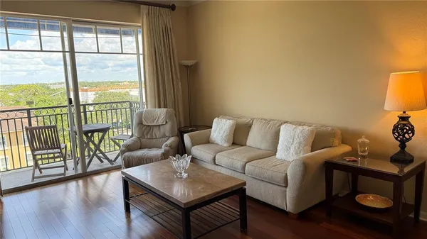 a living room with furniture and a window