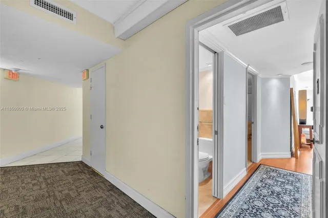 a bedroom with furniture and a wooden floor