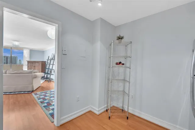 a view of an empty room and a window