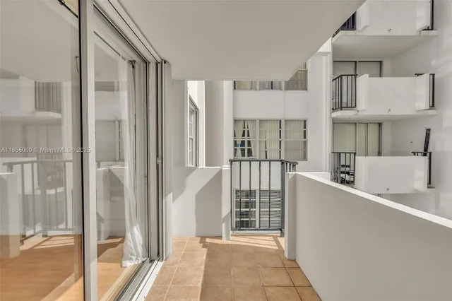 a bathroom with a glass door shower a toilet and a sink
