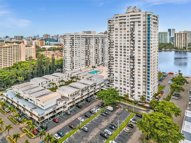 a view of swimming pool outdoor seating and city view