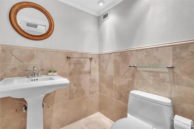 a kitchen with stainless steel appliances granite countertop a refrigerator a stove and a sink