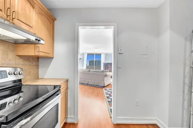 a kitchen with a stove oven and sink