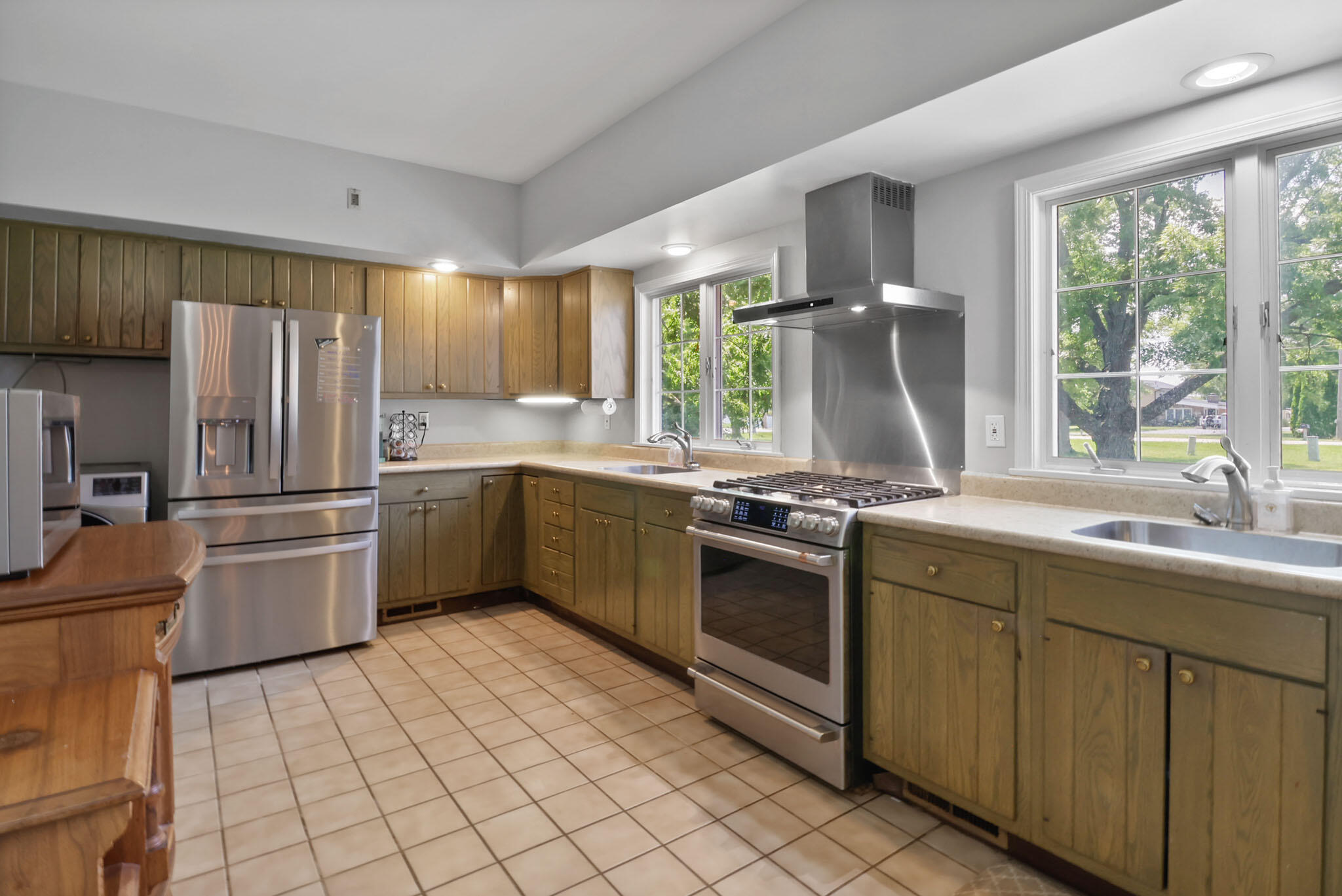 12819 Grant Street Crown Point, IN 46307 - Photo 12 of 42 a kitchen with a sink appliances and cabinets