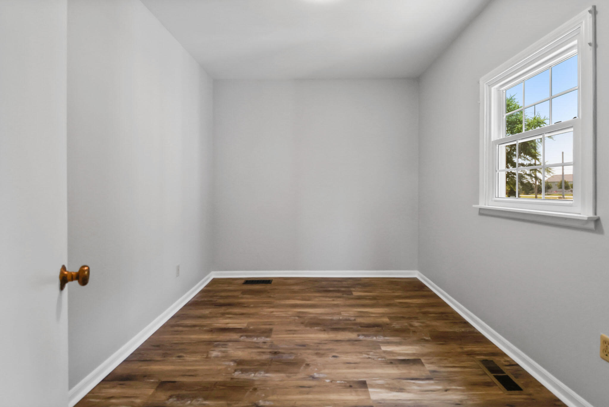 12819 Grant Street Crown Point, IN 46307 - Photo 17 of 42 a view of empty room with wooden floor