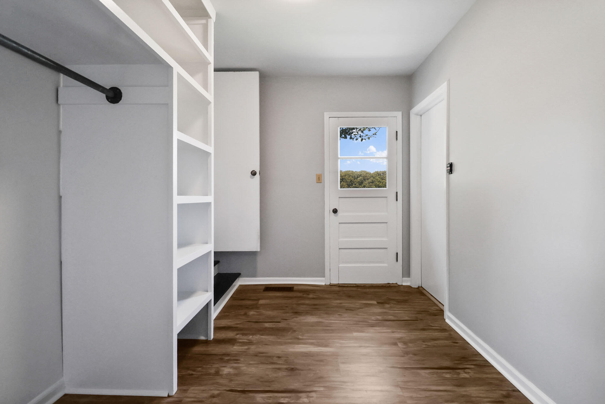 12819 Grant Street Crown Point, IN 46307 - Photo 18 of 42 an empty room with wooden floor