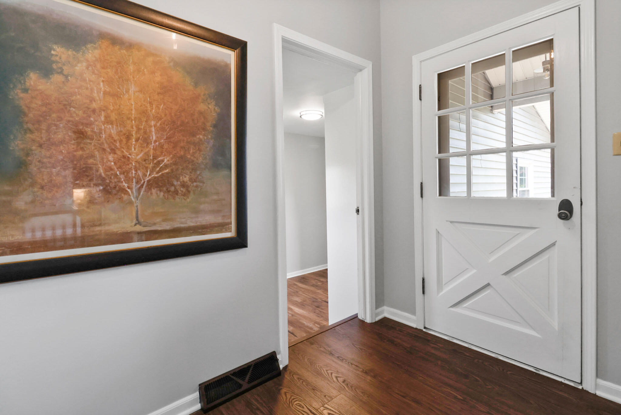 12819 Grant Street Crown Point, IN 46307 - Photo 19 of 42 a view of an entryway with wooden floor
