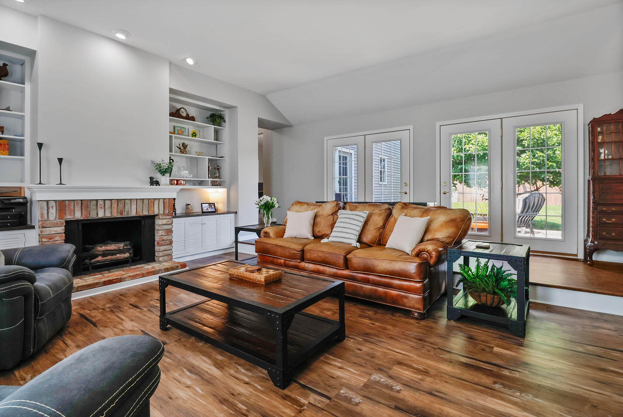 12819 Grant Street Crown Point, IN 46307 - Photo 2 of 42 a living room with furniture and a fireplace