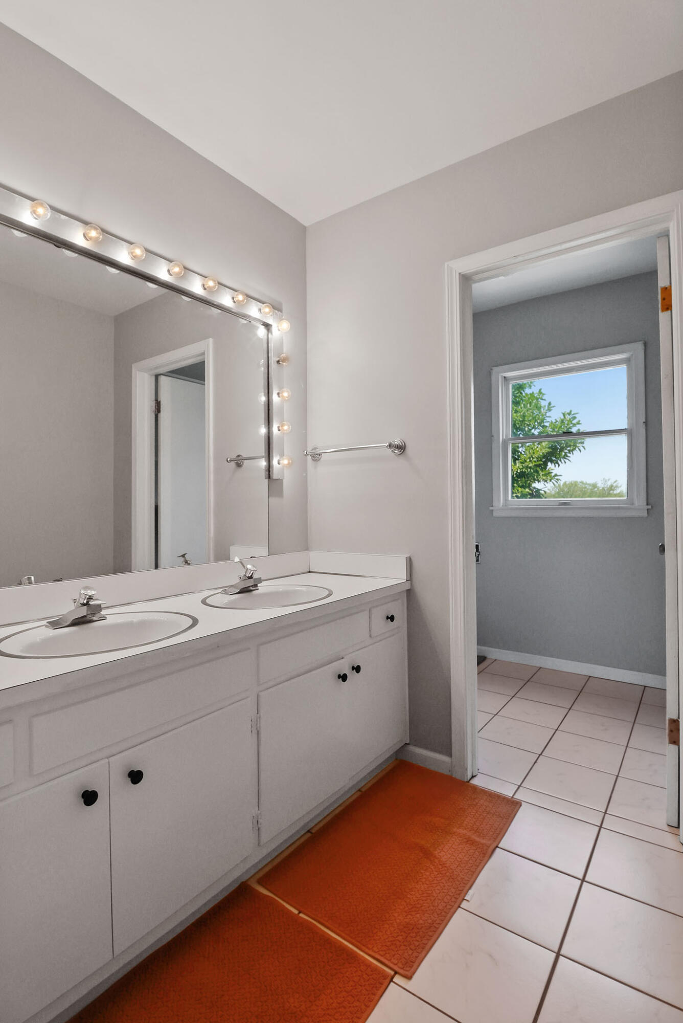 12819 Grant Street Crown Point, IN 46307 - Photo 21 of 42 a spacious bathroom with a double vanity sink and a mirror